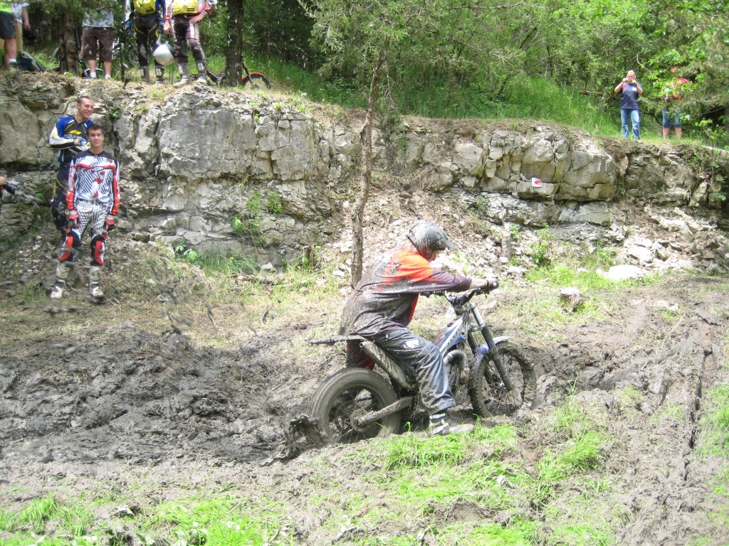 A support rider rips through the mud like a Bear